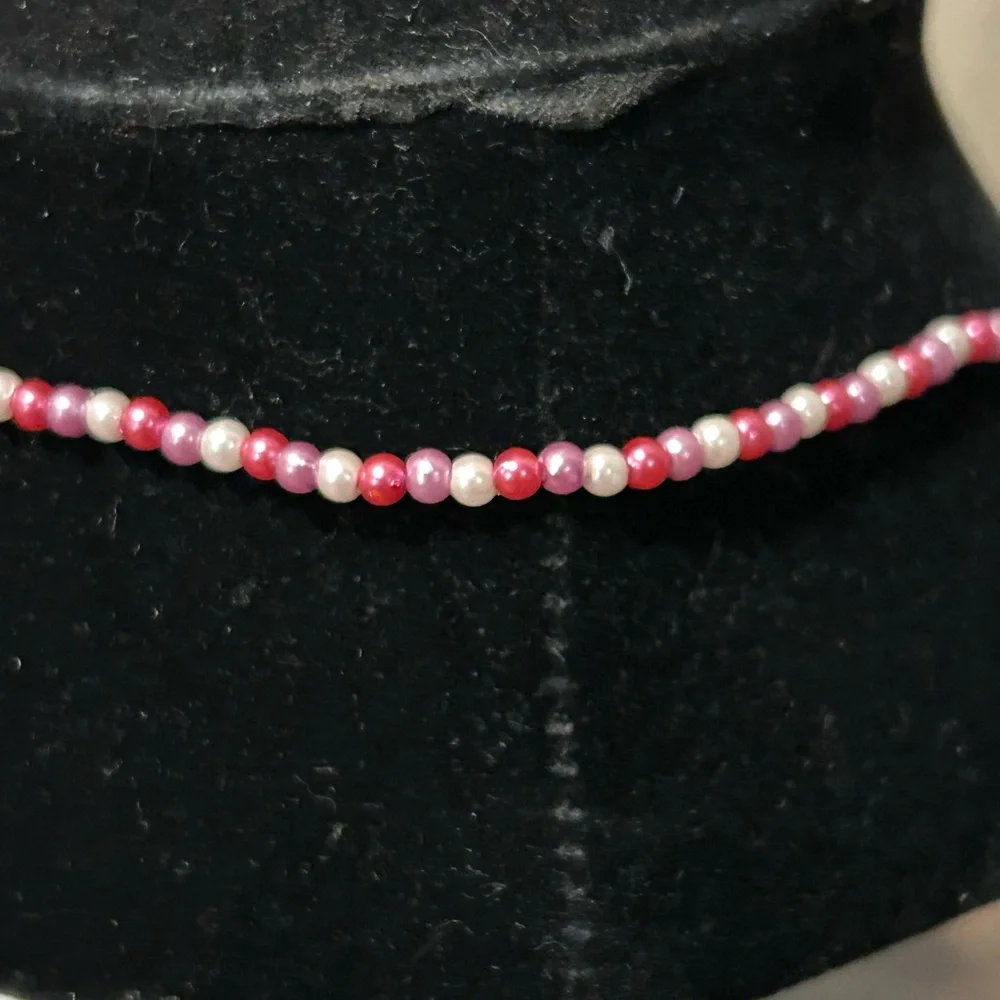 Pink and white beaded necklace with Dora the Explorer locket
